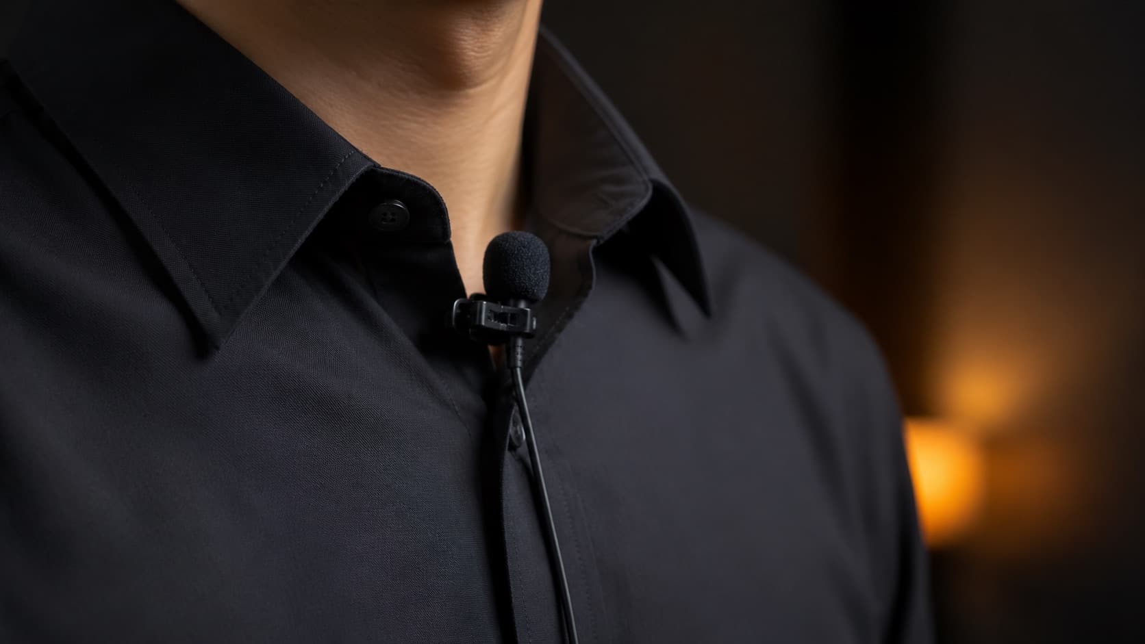 Lavalier microphone clipped to a collar
